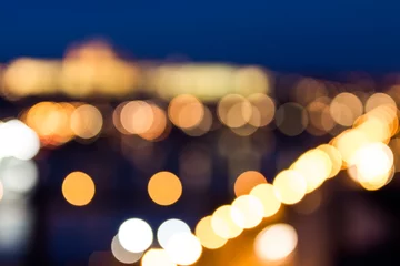 Tafelkleed Defocused bokeh of Prague and Vltava river from Vysehrad - Romantic view after misty sunset with emotional color filter - European capital of bohemian Czech Republic © daliu