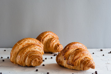 Croissant for breakfast. Chocolate crumbs.