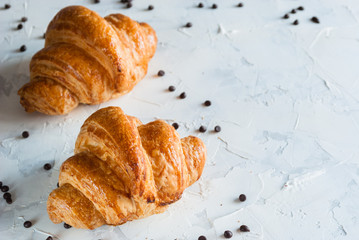 Croissant for breakfast. Chocolate crumbs.