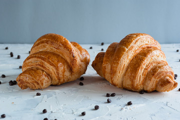 Croissant for breakfast. Chocolate crumbs.