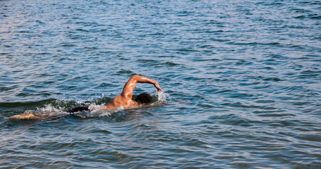 man swimming in lake ontario