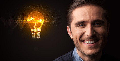Portrait of a young businessman on dark background