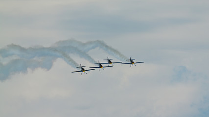 4 planes at airshow. Teamwork. Acrobat.