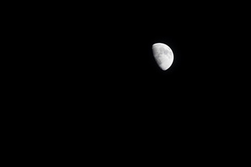 half moon on dark sky