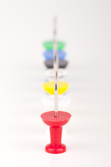 Row of colorful pushpins