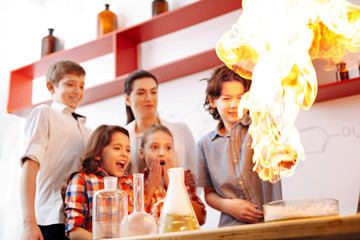 Surprised nice children looking at the fire