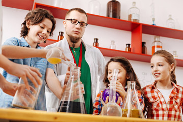 Positive delighted children attending a scientific club