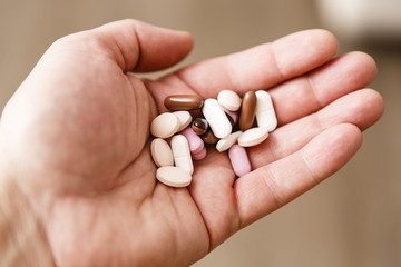 pills in woman hand, drug addiction