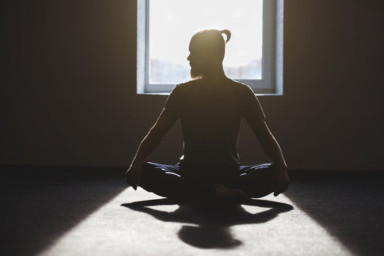 Man meditating during a yoga practice. The concept of freedom, physical health and sport lifestyle.