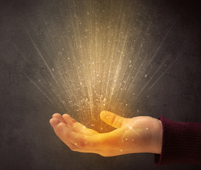 Hand holding yellow light