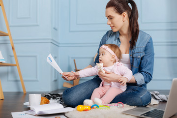 Hardworking strong mother perusing data research