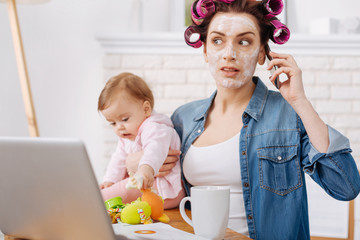 Emotional charismatic young woman looking shocked