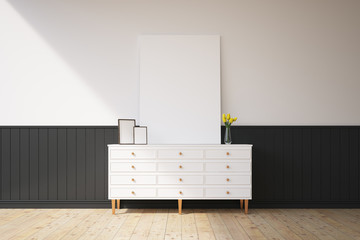 Cabinet with pictures on it, white wall