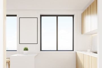 Light wood kitchen interior with a table, side view