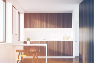 Dark wood kitchen interior with a table, toned