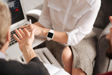 Nice handsome man looking at the laptop screen