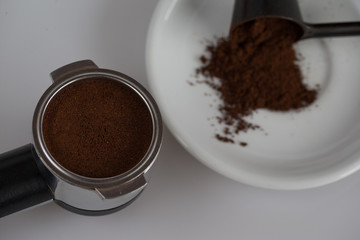 ground coffee in filter holder