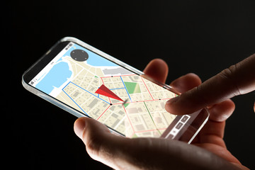close up of hand with gps map on smartphone
