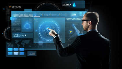 businessman pointing finger to virtual screen