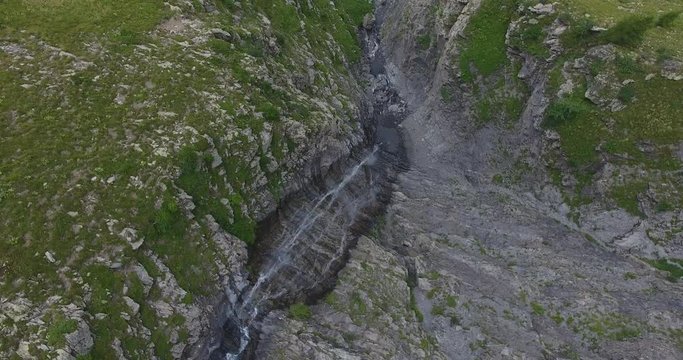 aerial shot waterfall alps