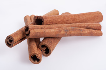 Cinnamon sticks on white background.