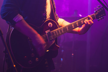 Fototapeta na wymiar Electric guitar player on stage