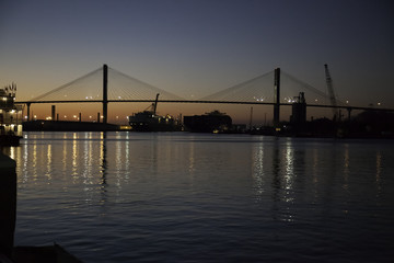 Fototapeta na wymiar Savannah River with bridge, at sunset