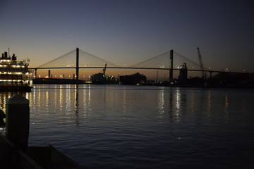 Fototapeta na wymiar Savannah River with bridge, at sunset