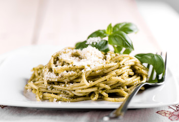 Spaghetti pesto with parmesan cheese and basil