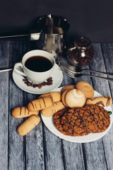 Cookies, sweets, coffee mug tea on the table