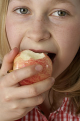 Girl eating an apple