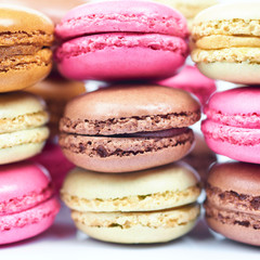 Colorful french macaroons on a white background