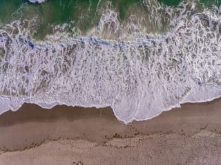 Above View of the waves crashing 