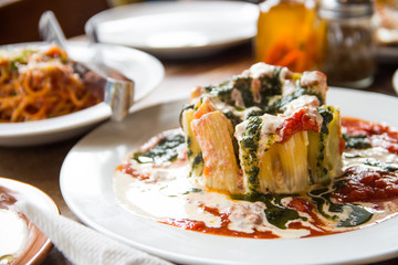 tomato cream pesto pasta with mozzarella cheese below