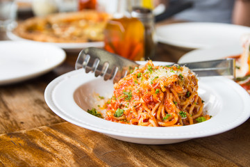 tomato pasta sprinkled with basil