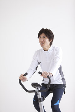 Young Man on Exercise Bike
