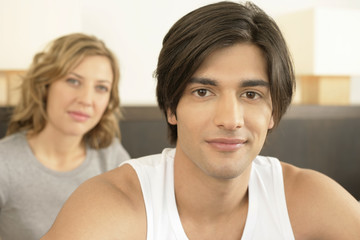 Young couple looking at camera