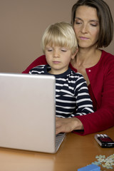 Mother and son (4-5 Years) using a laptop