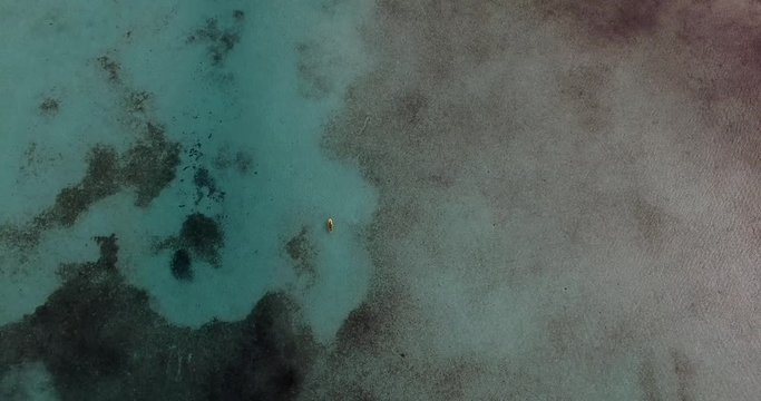 Top View of a yacht on green reef ocean, Bahamas