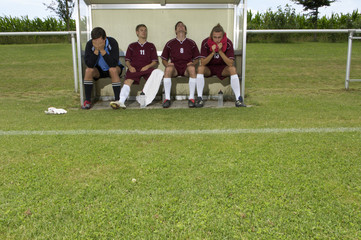 Disappointed kickers sitting on substitutes' bench