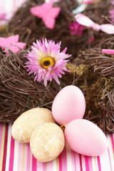 Obraz na płótnie Canvas Easter eggs next to a nest, close-up, selective focus