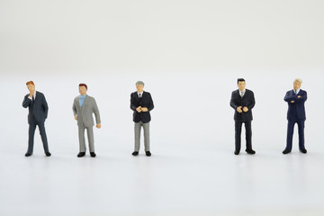 Businessmen figurines standing in a row