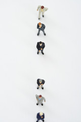 Businessmen figurines standing in a row