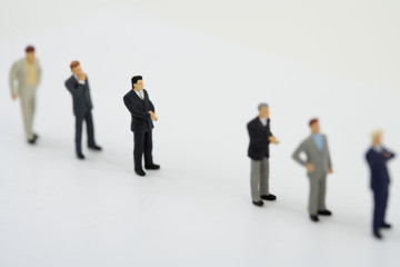 Fototapeta premium Businessmen figurines standing in a row