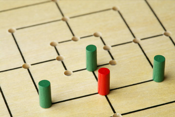 Nine men's morris with game pieces