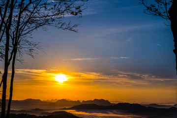 Beautiful Landscape of Sunrise with mist, sky and cloud shooting from top mountain at Phu Bo Bit, Loei, Thailand