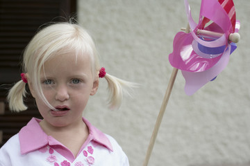 Little girl with a pin wheel in her hand