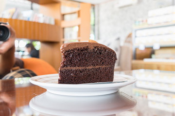 Double chocolate cake on the table in cafe, Coffee time concept.