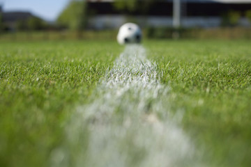 Ball lying on white line