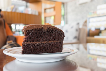 Double chocolate cake on the table in cafe with copy space, Coffee time concept.